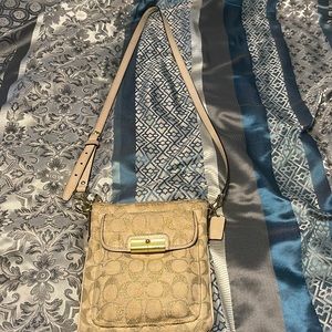 Tan and gold coach crossbody bag